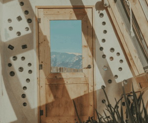 Earth houses incorporate recycled materials like glass bottles within the construction