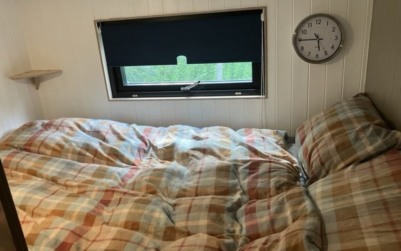 double bed with window to discover the ever changing view from bed