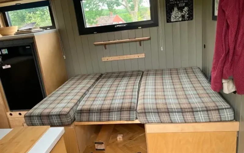 The seating area converts to a double bed for guests
