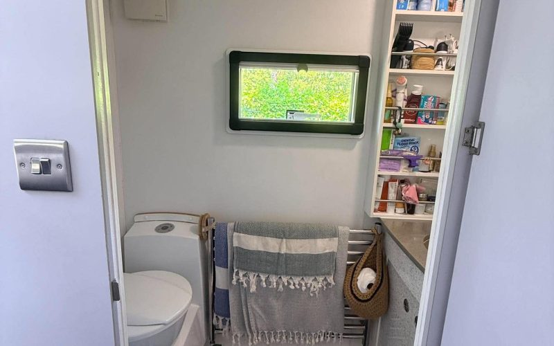 Bathroom with toilet, shower and sink