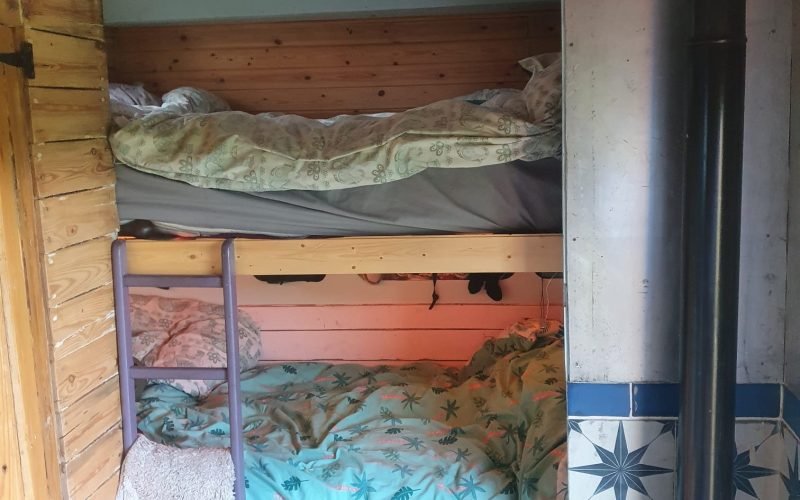 king-sized bed with single bed below king-sized bed with single bed below