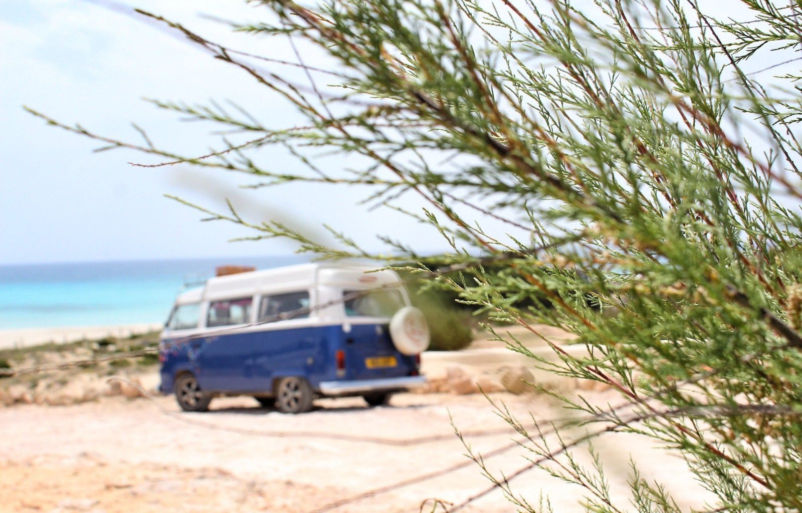 Camper van parked by a beach